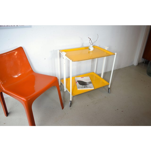 This is a colorful serving cart in a rare shade of yellow. Made in Germany in the late 1970s. The original Formica...