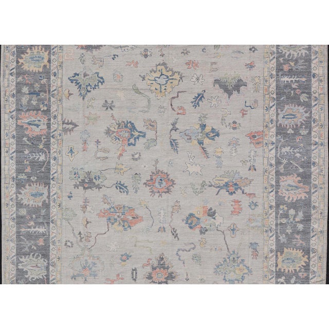 Modern Oushak Rug With Slate Blue Border and Colorful All-Over Tribal Motifs For Sale - Image 15 of 15