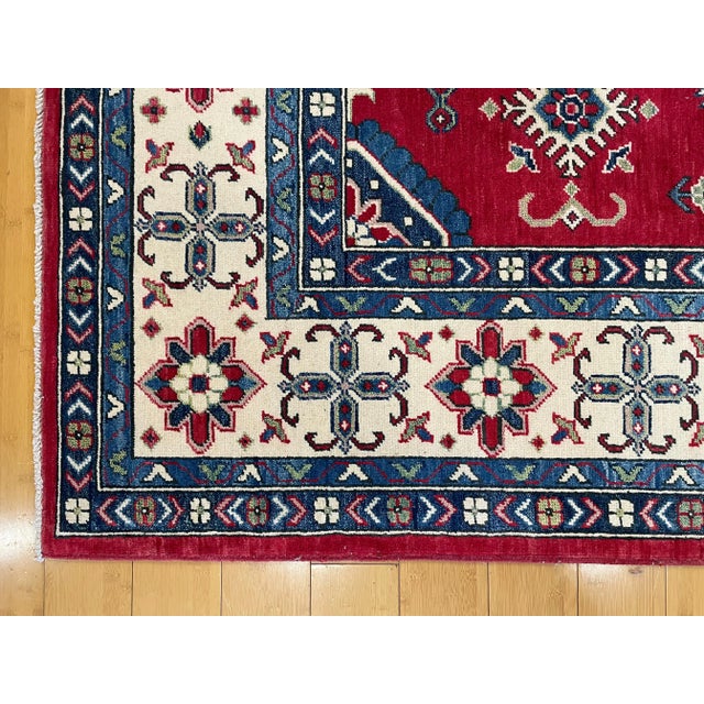 Ruby Red Hand Knotted Fine Wool Kazak Rug | Vintage Tribal Caucasian Area Rug | 74" X 109" For Sale - Image 8 of 10