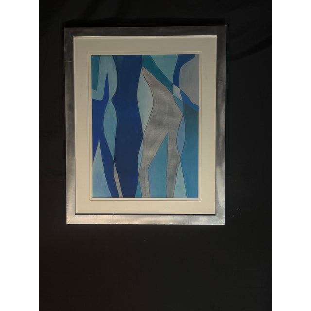 Modern abstract artwork featuring layered organic shapes in shades of blue, navy, turquoise, gray, and metallic silver....
