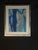 Modern abstract artwork featuring layered organic shapes in shades of blue, navy, turquoise, gray, and metallic silver....