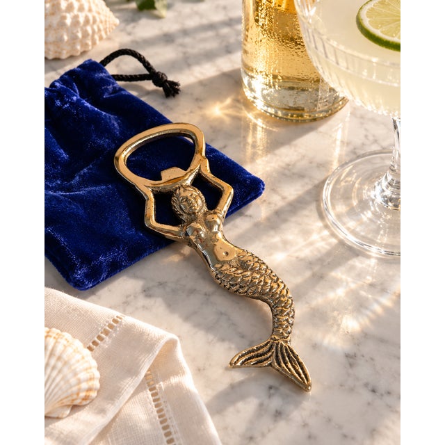 Decorative late-20th-century solid-brass bottle opener handcrafted in India in the form of a sculptural mermaid. The...