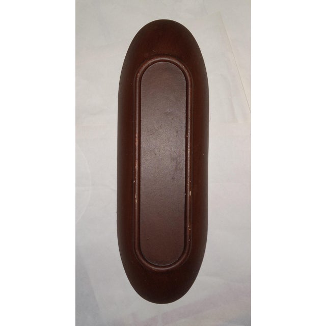 This bowl works well as a display stand on an entryway table or dresser. Its deep brown tone blends in with classic decor...