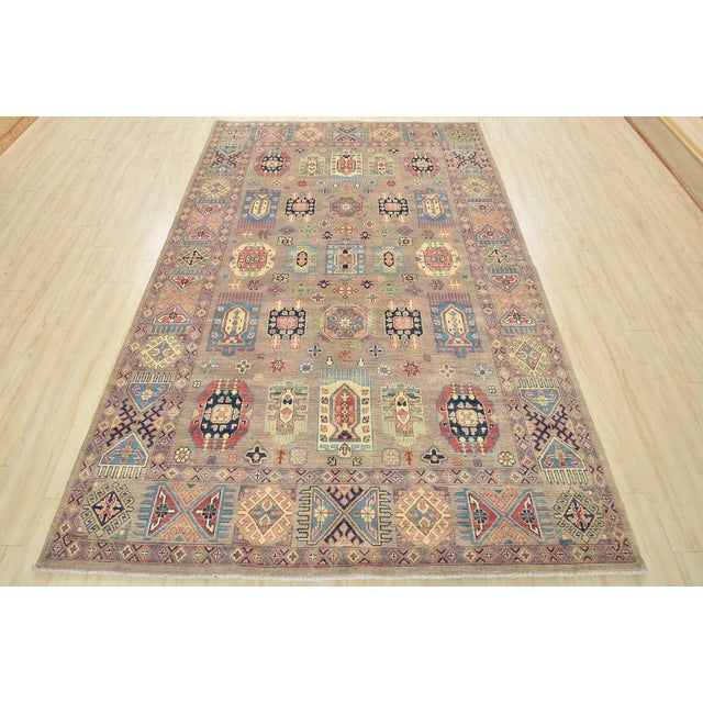 This traditional tribal geometric Caucasian rug is hand-knotted with an all-wool pile on a cotton foundation. This rug is...