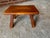 This is a Cushman of Vermont Colonial Creation Cricket Stool No. 9038. It is 14" wide, 9" deep, 8" high. Made of Maple.