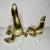 Elevate your home decor with this stunning pair of vintage mid-century brass sea lions, an exquisite addition for any...