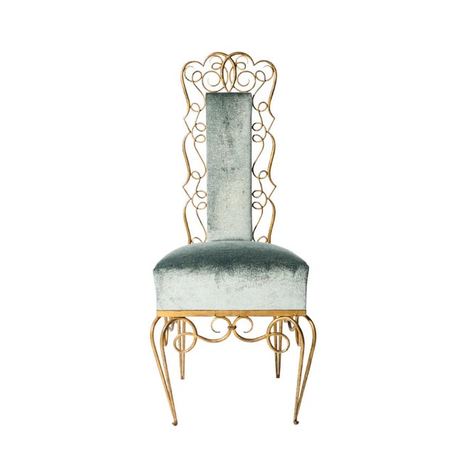 A pair of wrought iron René Drouet chairs decorated with gilt scrolls tracery. Newly upholstered in gorgeous Dedar,...