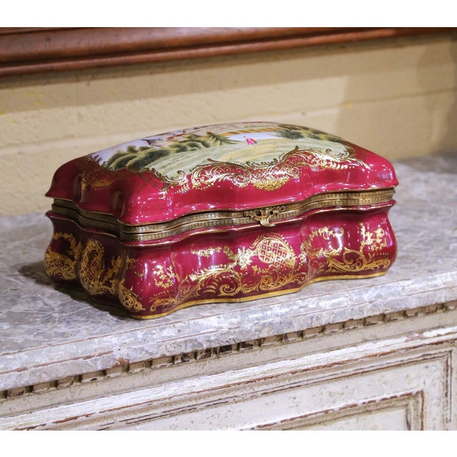 Decorate a vanity, dresser, or tabletop with this elegant antique porcelain jewelry box. Crafted in France circa 1920, the...