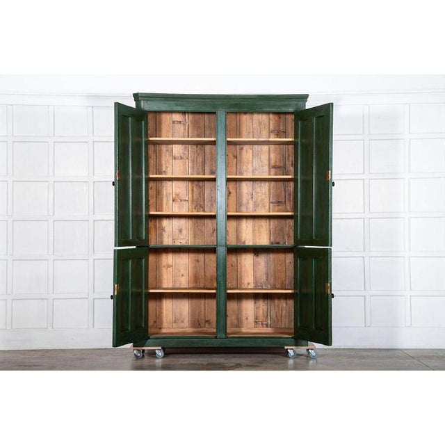 Large 19th-century english painted pine housekeeper's cupboard, circa 1880. overall dimensions: w165 x d50 x h239 cm base:...
