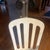 Late 1920s-30s white cast iron dentist chair; chrome arm rests and seat; seat can be raised or lowered; chair reclines;...