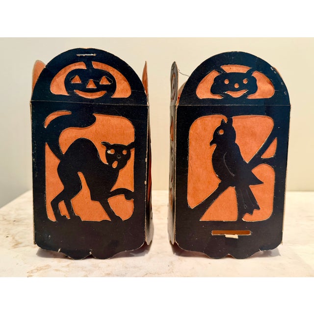 Rare set of two matching vintage die cut cardboard and tissue paper four-sided Halloween lanterns. Each lantern is made of...