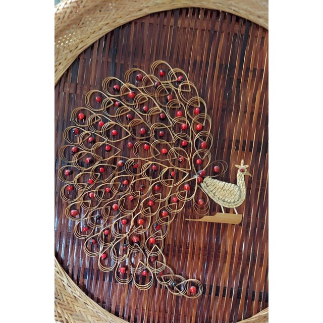 Peacocks are woven and decorated with seeds. The widest measures approximately 14 inches in diameter. The wicker is in...