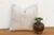 Subtle star and cross motifs appear in soft tone-on-tone stitching across this handcrafted Moroccan cactus silk pillow,...