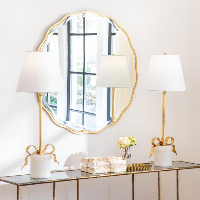 Refined and elegant, the Ribbon Lamp is composed of a tall gold leafed neck and molded metal ribbon atop a cylindrical,...