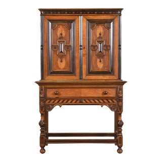 Antique Berkey & Gay English Jacobean Ornate Carved Walnut and Burl Wood Bookcase or Bar Cabinet, Circa 1920s For Sale