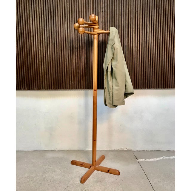 This sculptural Scandinavian coat rack was manufactured during the 1970s. The piece is made from solid pine. It features 8...