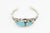 A striking Southwestern cuff bracelet attributed to Navajo silversmith Delbert Chatter, featuring two vibrant blue...