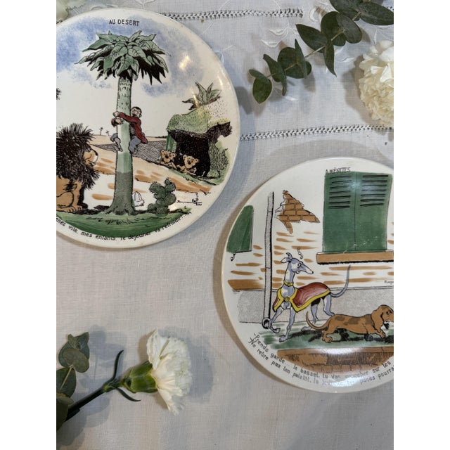 Sarreguemines earthenware from the 1950s-1960s, decorated with humorous vignettes. Designs by Benjamin Rabier, with his...