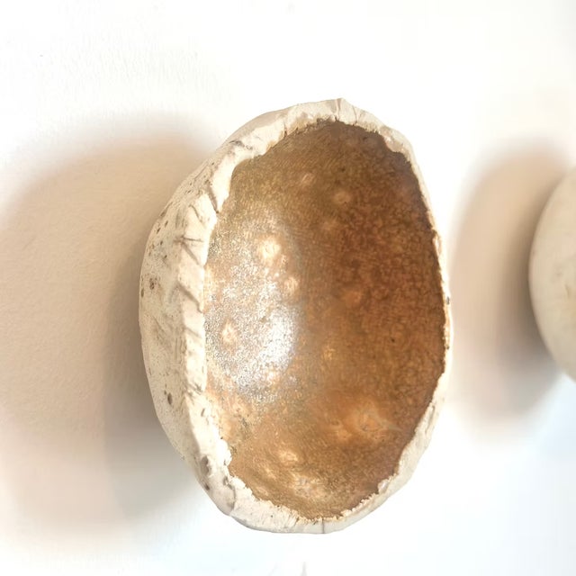 Moon Forms — Terra glazed in a rich, warm gold that shifts from amber to ochre depending on the light and the hour. Where...