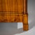 Elegant Biedermeier chest of drawers featuring four drawers and a distinctive pediment-shaped front, flanked by lateral...