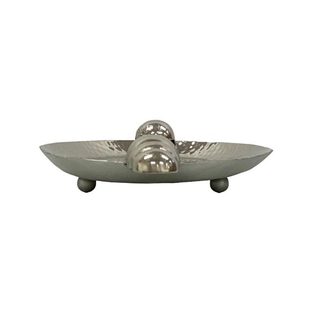 Featuring a oval hammered metal surface and distinctive stepped bubble handles, this tray brings texture, shine, and...