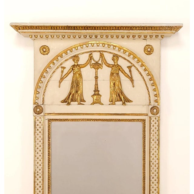 A Gustavian mirror with old plate and enamel paint, Sweden circa 1820.