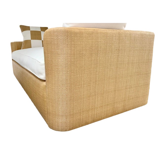 Custom handcrafted daybed by Danny Cannon Custom Upholstery, Inc. Features beautifully upholstered raffia sides paired...