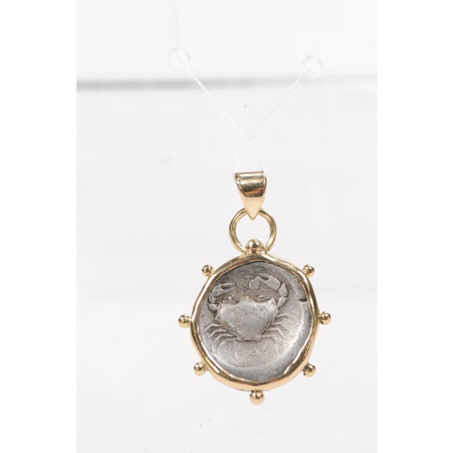 A Crab Didrama [coin] Pendant w/ 18 Karat Gold Trim & Bail. This ancient coin was minted at the ancient Greek city of...