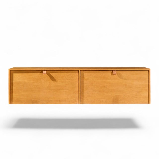 Florence Knoll 121W Mid Century Birch Hanging Credenza This credenza measures: 71.75 wide x 15.25 deep x 18 inches high...