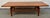 Bring timeless Mid-Century Modern style into your home with this elegant walnut coffee table designed by renowned Danish-...