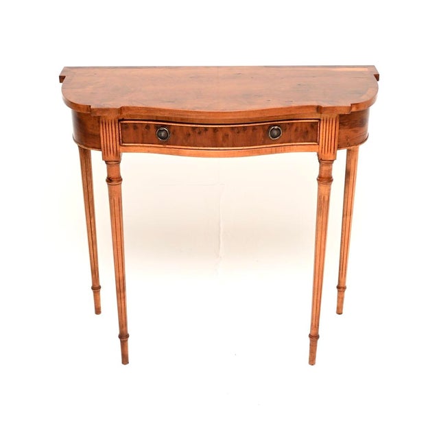 A beautiful and elegant antique Regency style yew wood console table. This was made in England, it dates from around the...
