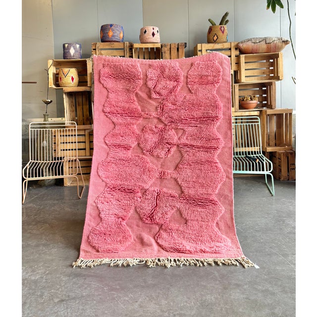 Handmade Moroccan Beni M’rirt rug woven from premium natural wool by Berber artisans in the Atlas Mountains. This...