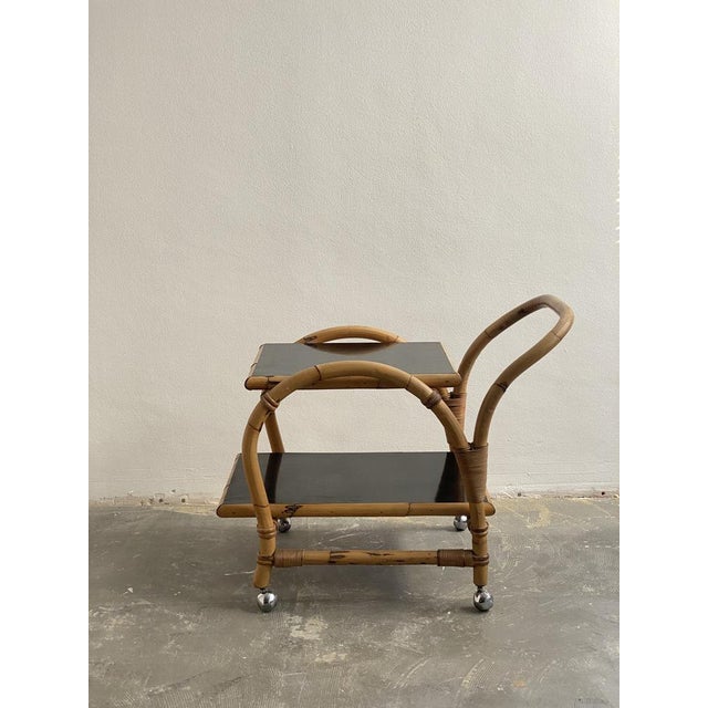 High-quality bar cart made from bamboo. Two shelves made of black Formica. The ARCO company is known for very high-quality...