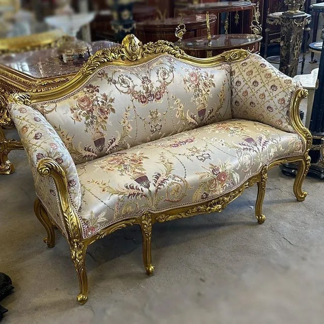 Stunning details. In love with the design. Elegance and comfort assured. Beautiful sofa with 2 pillows and gold details....
