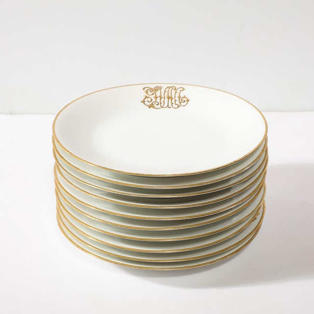 This exquisite set of 10 porcelain luncheon plates, crafted in France circa 1900, showcases the refined artistry of...