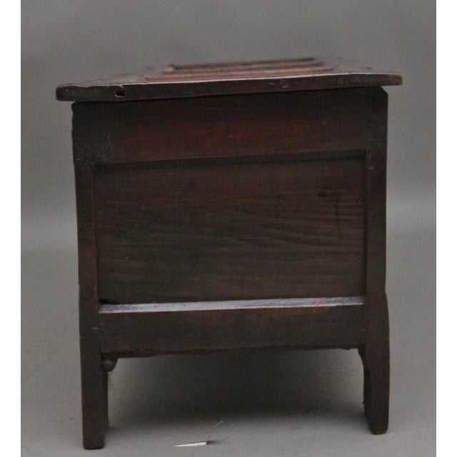 18th Century oak coffer with the hinged three panelled top opening to reveal a large compartment space, the two panelled...