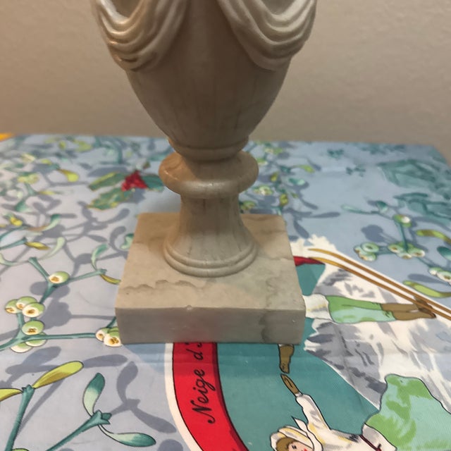 Add a touch of timeless elegance to your home with this beautiful neoclassical-style urn sculpture. Designed to mimic the...