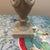 Add a touch of timeless elegance to your home with this beautiful neoclassical-style urn sculpture. Designed to mimic the...