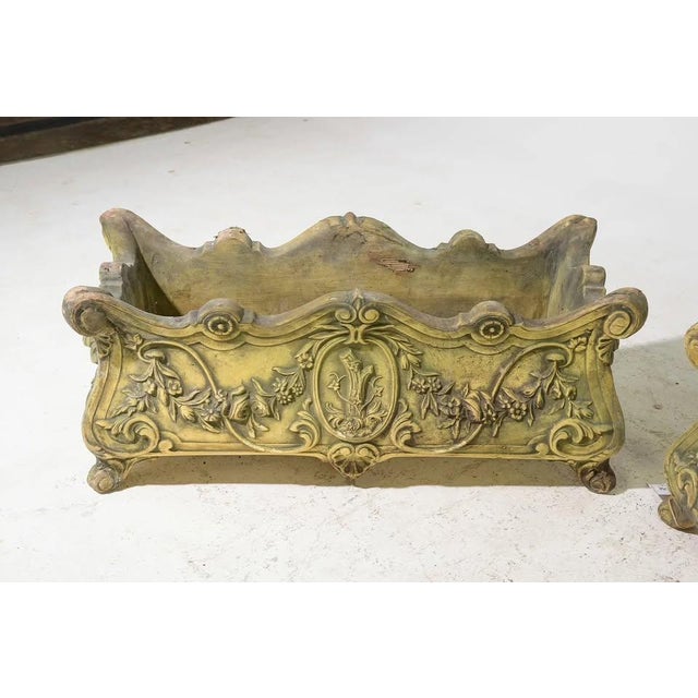 Elegant vintage cast stone planter with beautifully detailed French-inspired relief carvings and a naturally aged patina...
