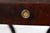 Antique sculptural side table. Mahogany with brass lions heads and other details. Embossed leather top is distressed in...
