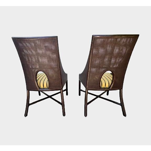 A little used set of caned armchairs from Barbara Barry for The McGuire Company. Finish color: Dark Tobacco. Fabric:...