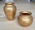 Striking pair of vintage Italian decorative vases crafted in terracotta with hand-applied gold leaf, each formed in a...