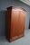 Thomasville Impressions cherry armoire featuring softly arched crown molding, paneled double doors, molded base, and a...