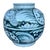 Bold and sculptural, this hand-painted blue and white jar features a stylized sunflower motif framed by sweeping...