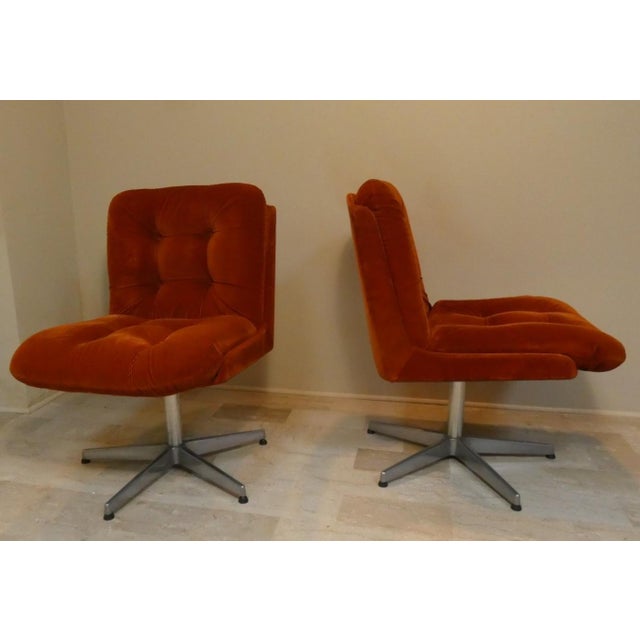 Stunning pair of swivel chairs with a steel frame and five-star base. A gorgeous rust-colored, pinstriped cotton velvet...