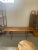 Coffee Table with Symmetrical Wood Grain. Lower Shelf is Wicker, wrapped around Sides.Tapered Legs. Vintage Condition...