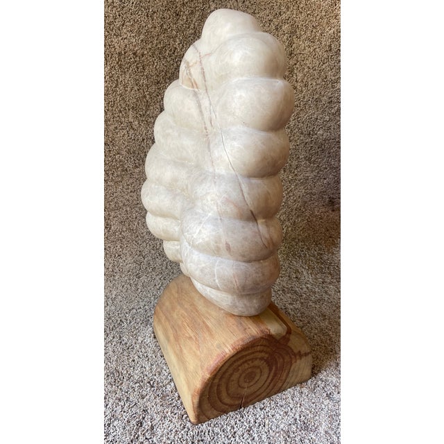 Hand carved by California Sculptor, Christoff Van Kooning, this one of a kind sculpture is carved from Alabaster that the...