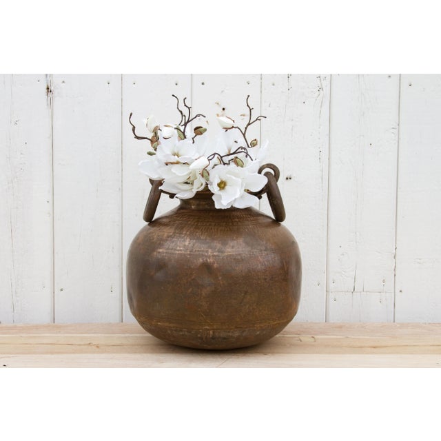 This gorgeous antique Indian brass planter with handles is a perfect addition to any space, combining a unique antique...