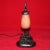 This is an authentic table lamp from the Art Deco period (1920's to 1930's). The base is wrought iron that features a...