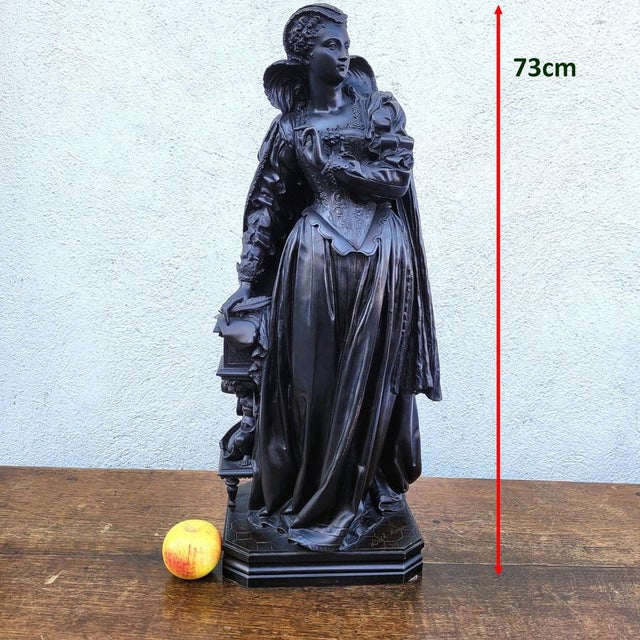 Large bronze sculpture with a brown patina, depicting Mary Stuart: a young woman in elegant and refined attire, adorned...